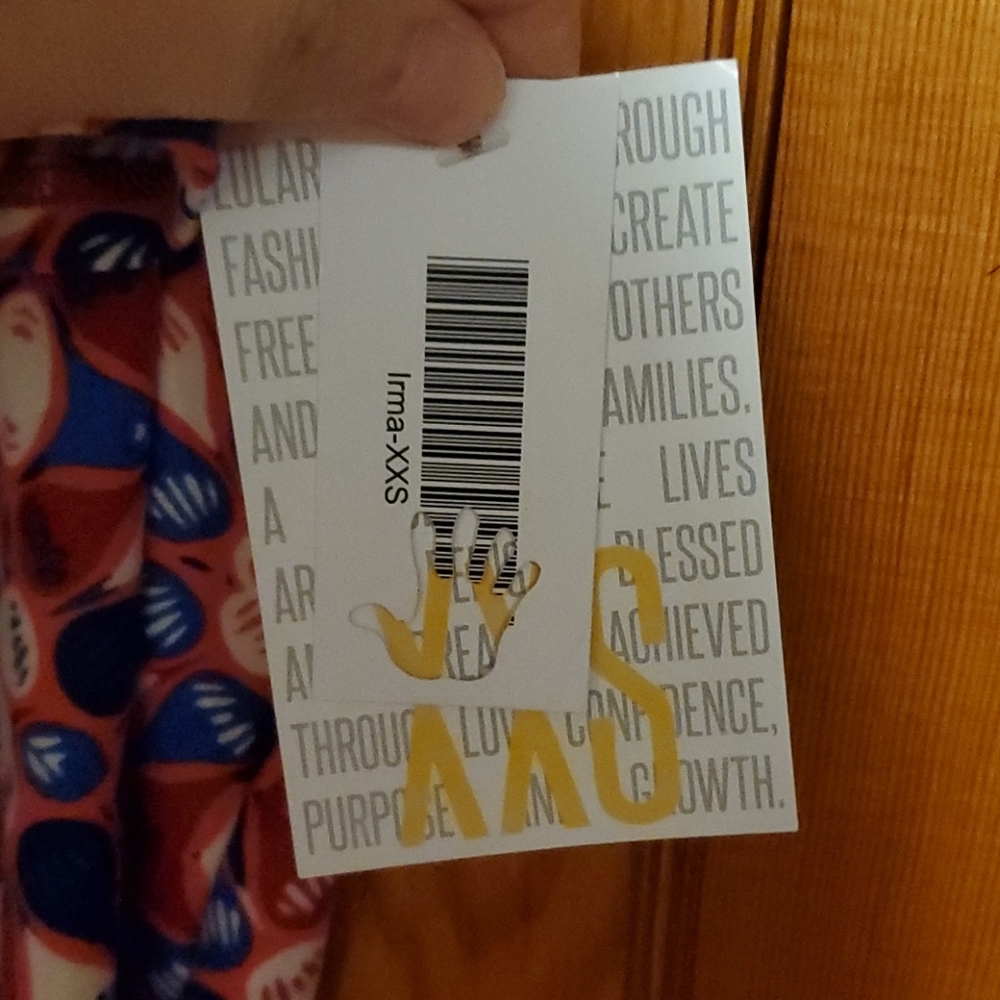 LuLaRoe Brand New with tags XXS Irma shirt.